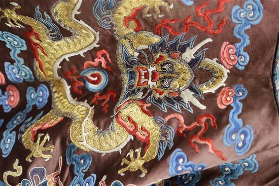 A Chinese embroidered silk and gold thread dragon jacket, late Qing dynasty, alterations